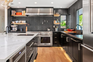 Picture of kitchen looking at oven and granite counters