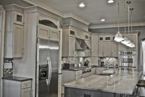 Picture of kitchen looking at oven and granite counters